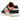 Nike Dunk Low PRM Halloween sneakers i vinkelret visning med hvid og sort overdel, orangerød swoosh og glød-i-mørke detaljer