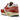Nike Air Max 1 Red Stardust sneakers i vinklet profil med rød læder mudguard, lys overdel og synlig Air enhed i hvid mellemsål
